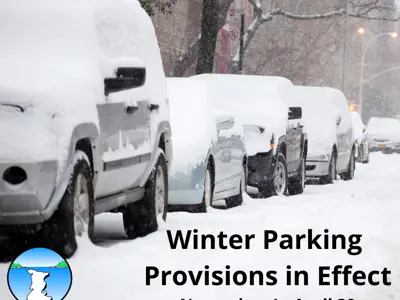 Cars parked on a snow covered road