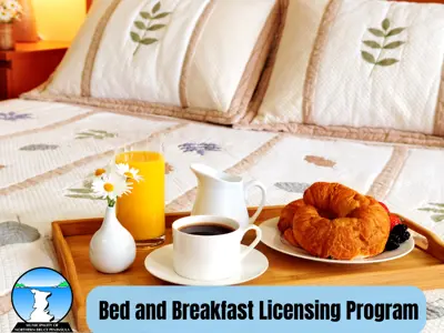 Tray with assorted Breakfast foods on top on a bed quilt with embroidered leaves. 